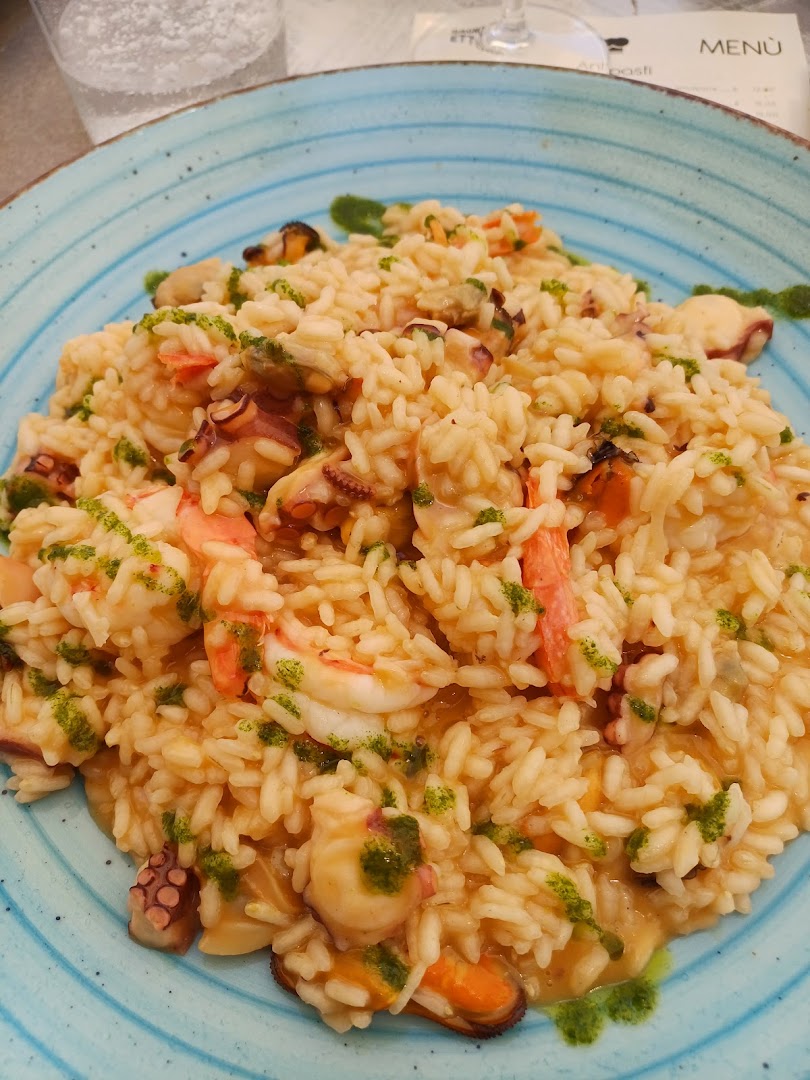 Risotto ai frutti di mare con gamberi e olio alle erbe